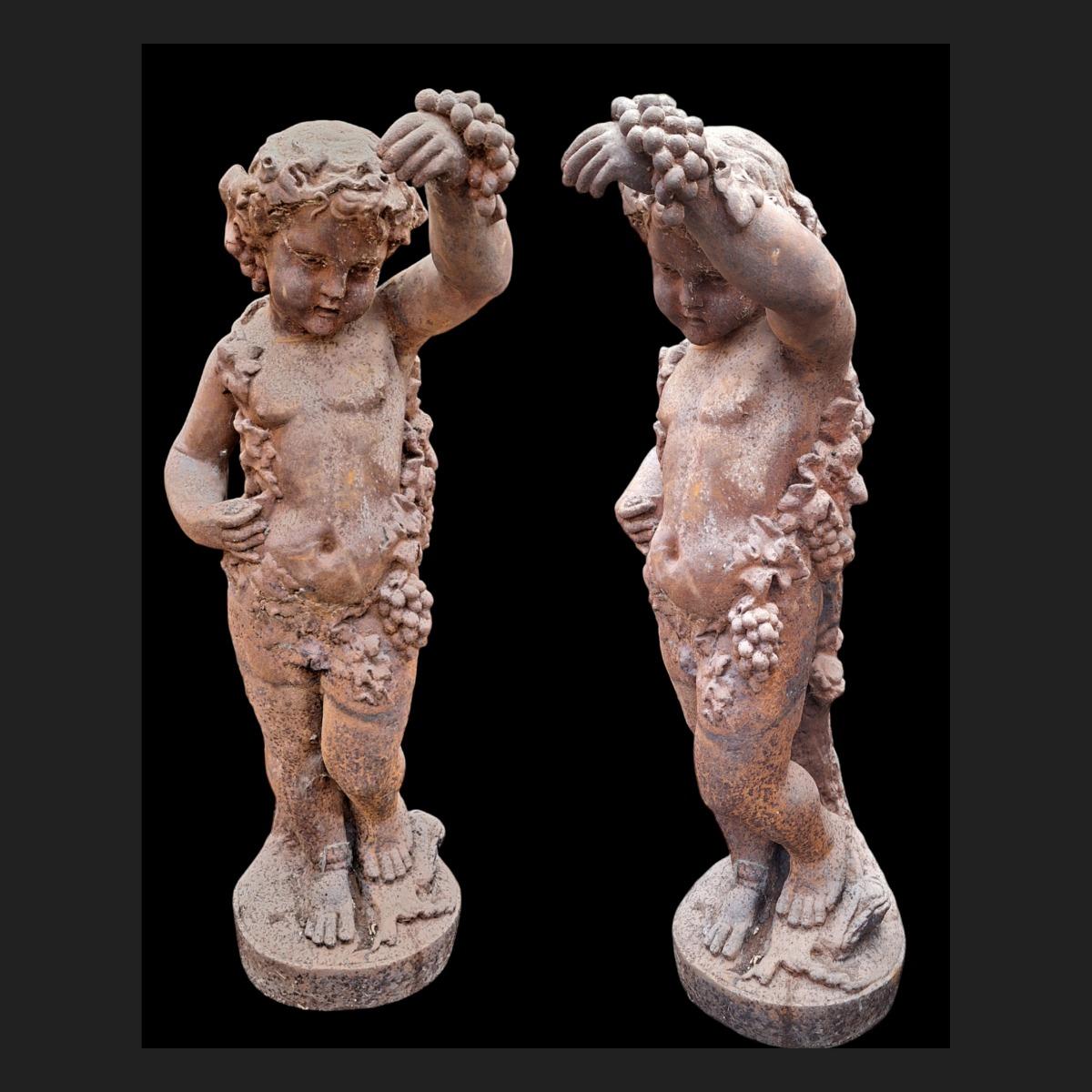 2 cherubs in cast iron.