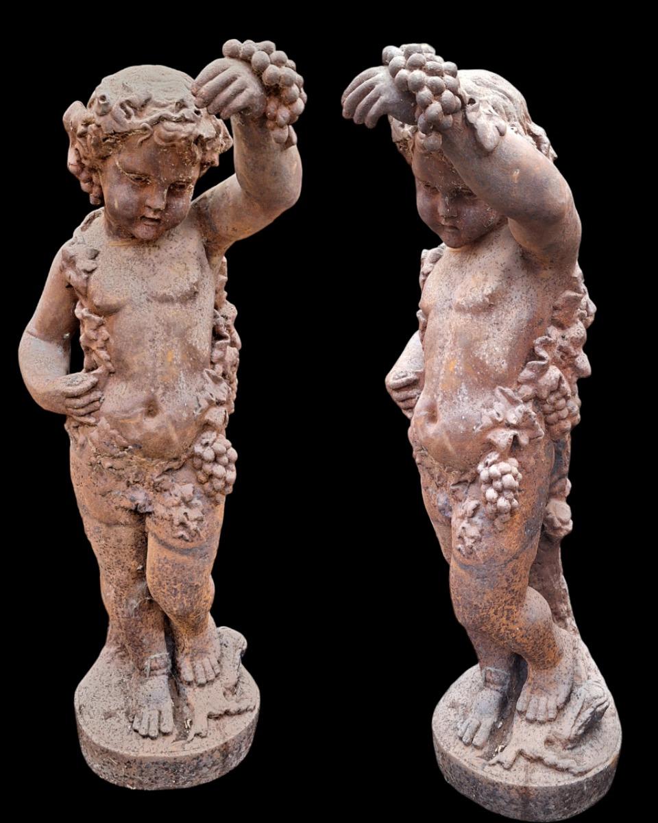 2 cherubs in cast iron.