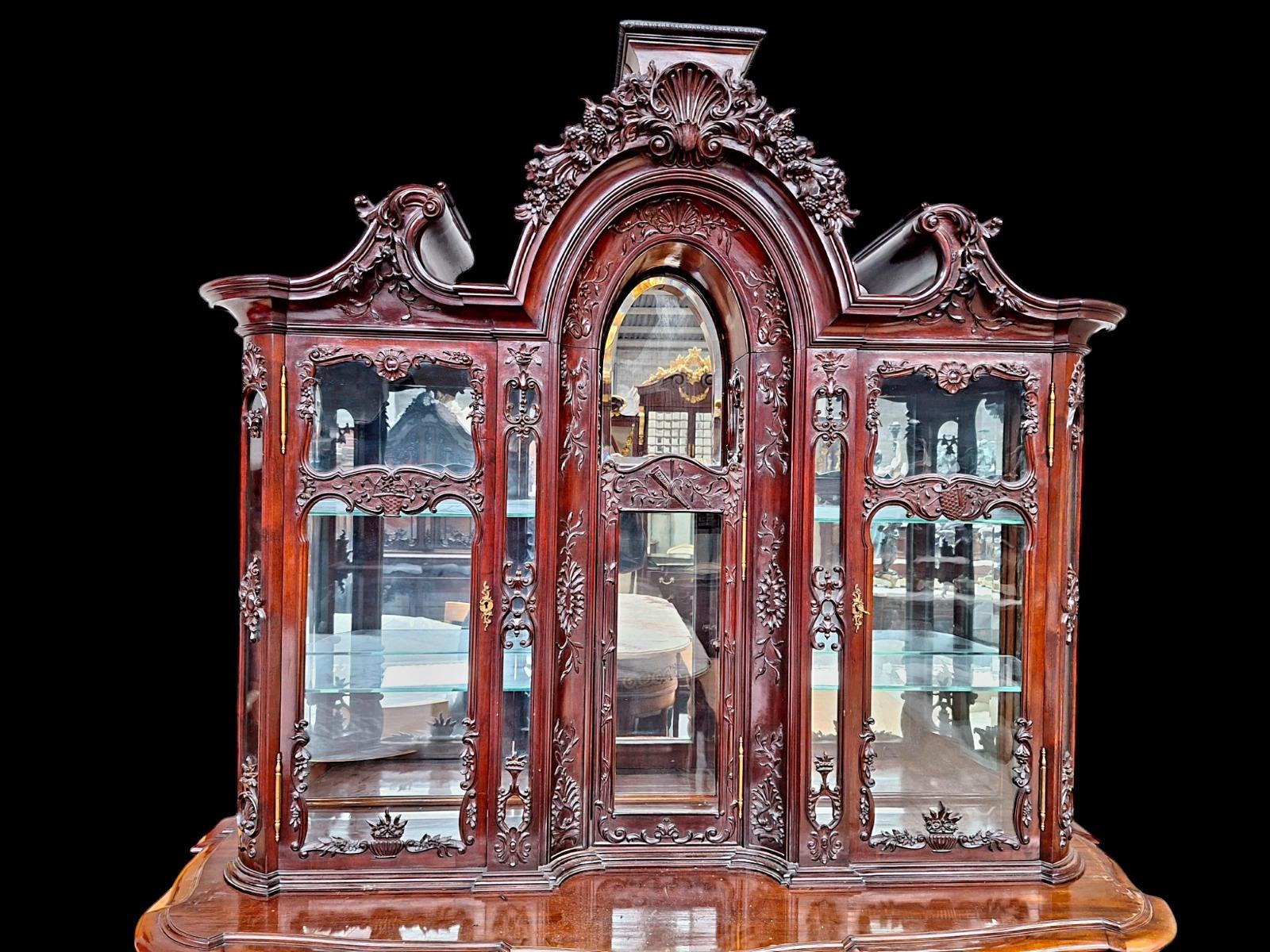 A hardwood Louis XV style display cabinet