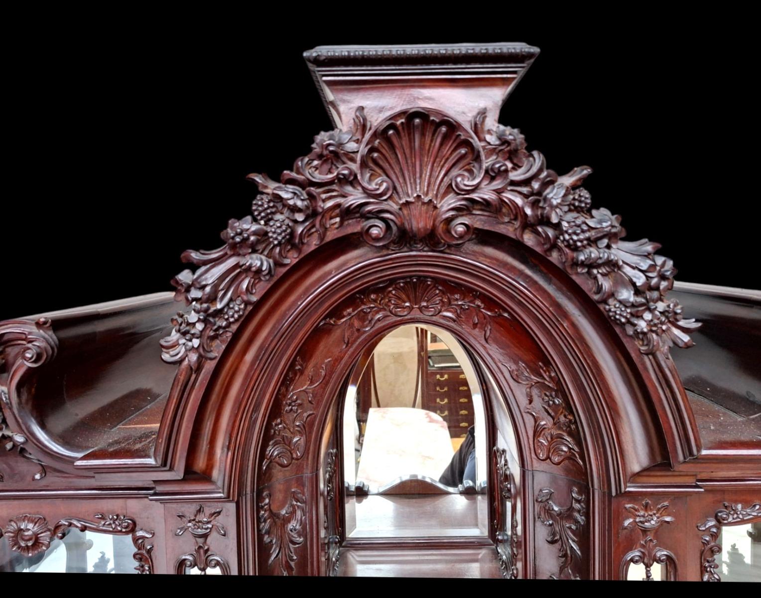 A hardwood Louis XV style display cabinet