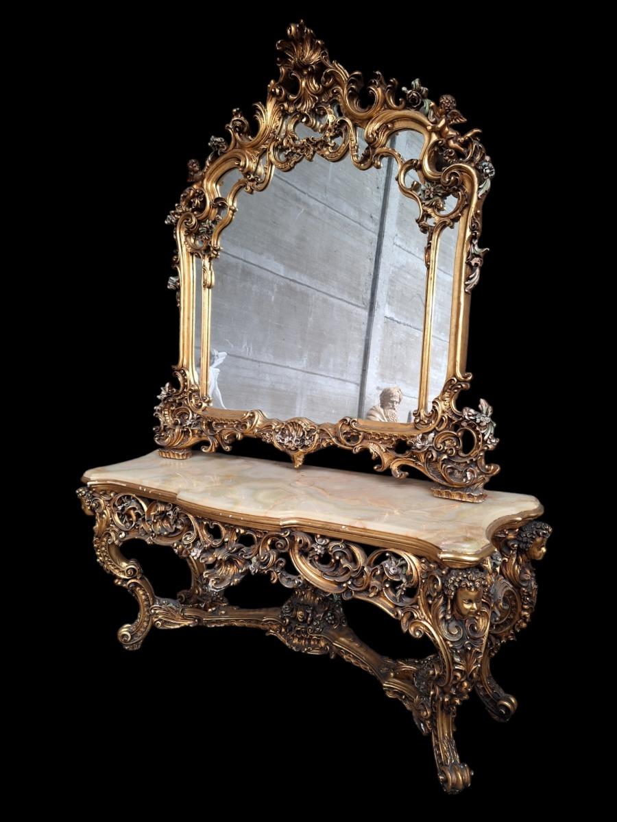 A large decorative wall console with mirror