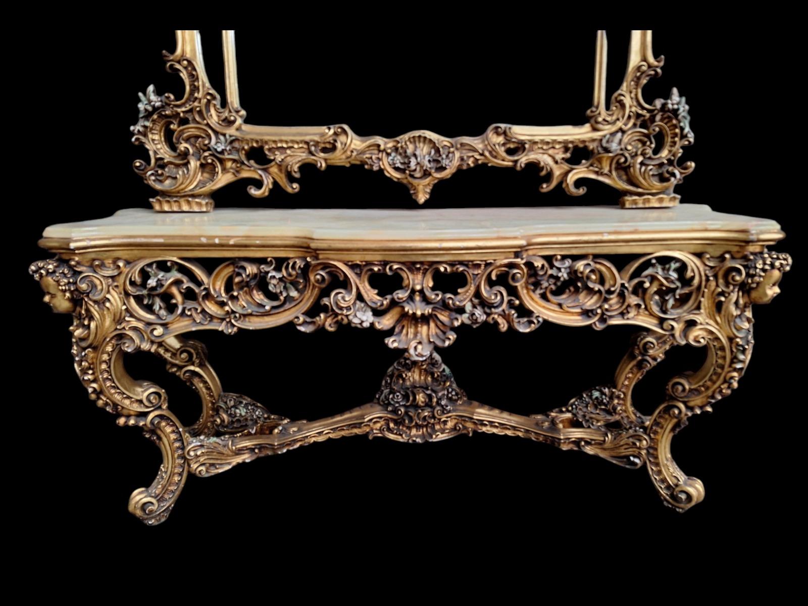 A large decorative wall console with mirror