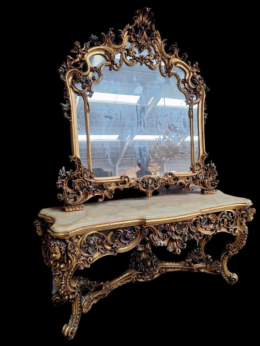 A large decorative wall console with mirror