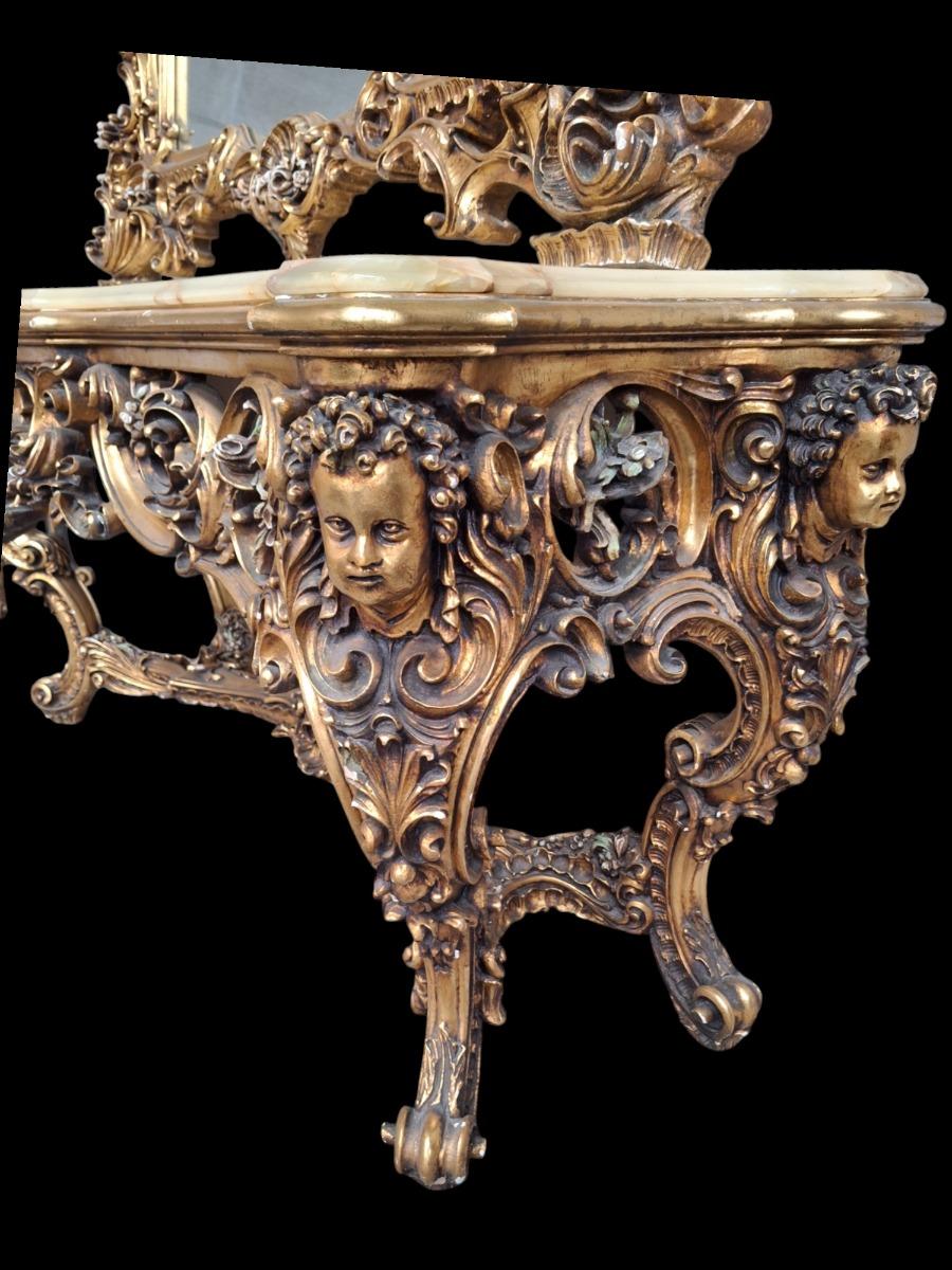 A large decorative wall console with mirror