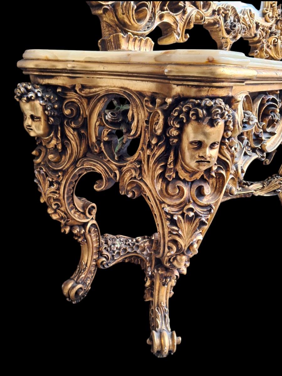 A large decorative wall console with mirror