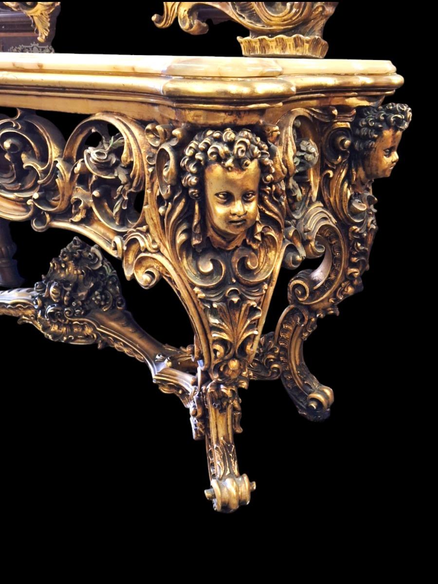 A large decorative wall console with mirror