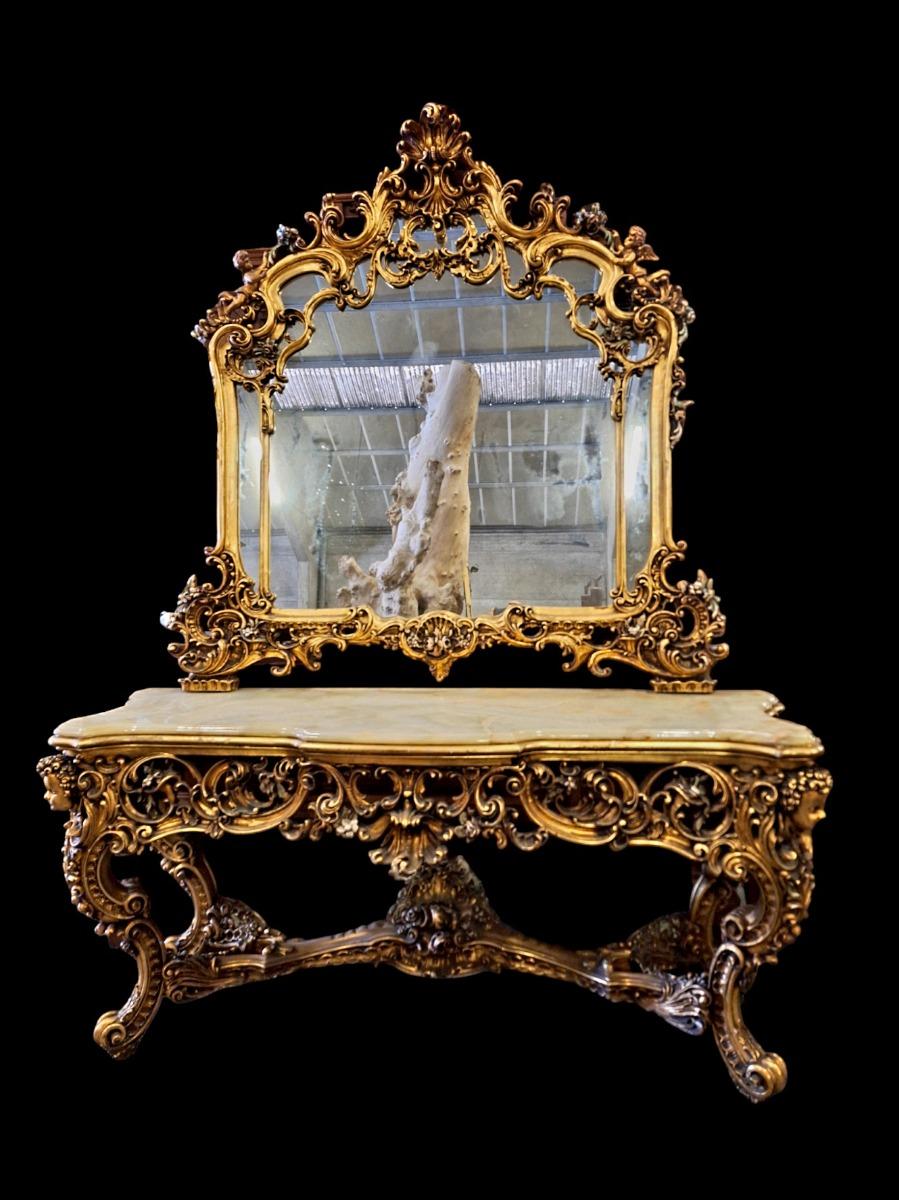 A large decorative wall console with mirror