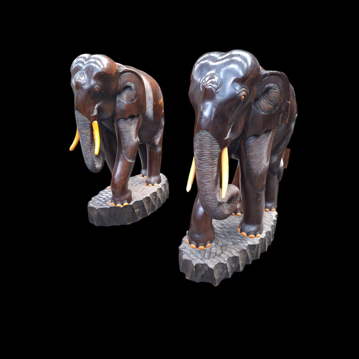 A pair of dark hardwood elephants.