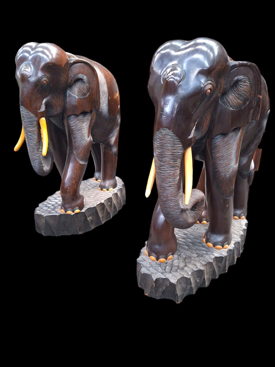 A pair of dark hardwood elephants.