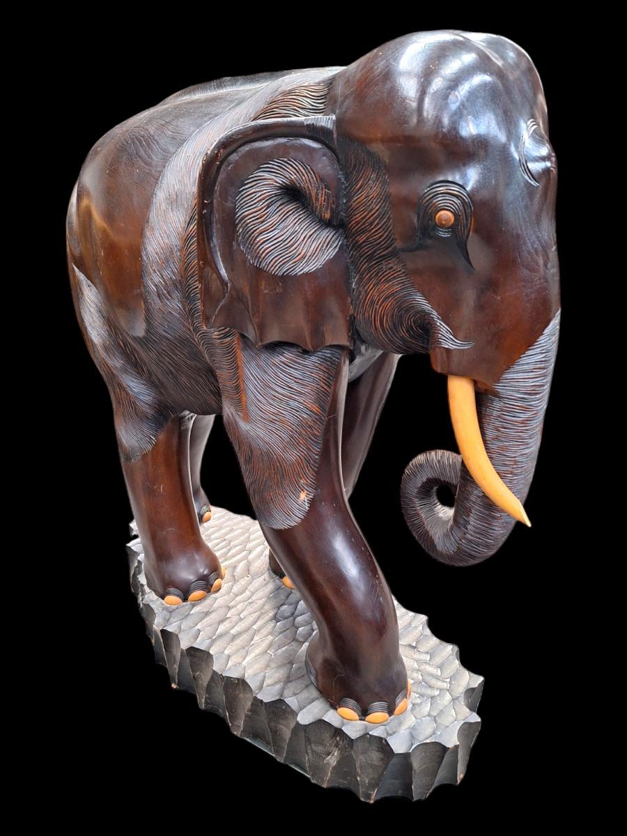 A pair of dark hardwood elephants.