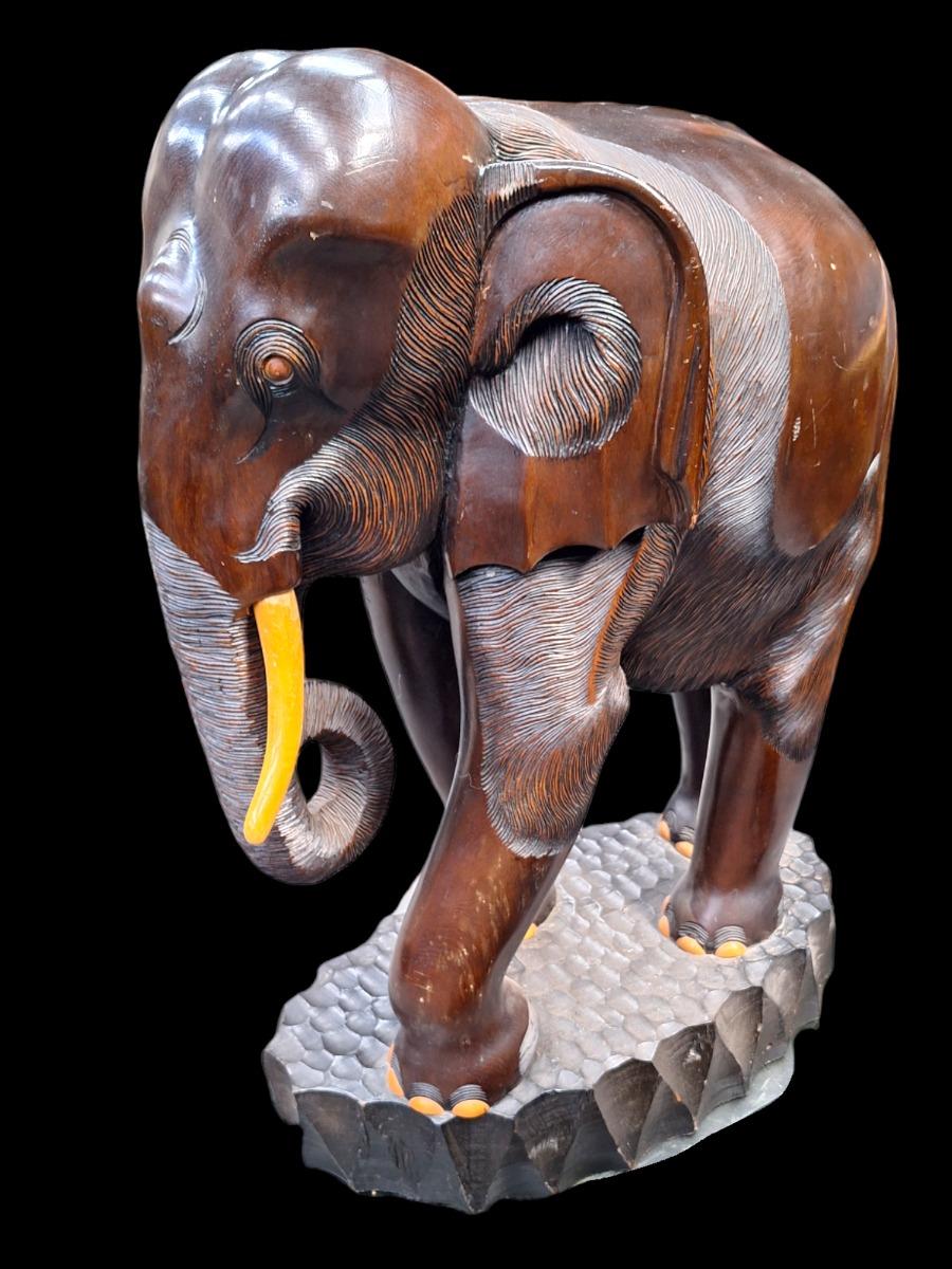 A pair of dark hardwood elephants.