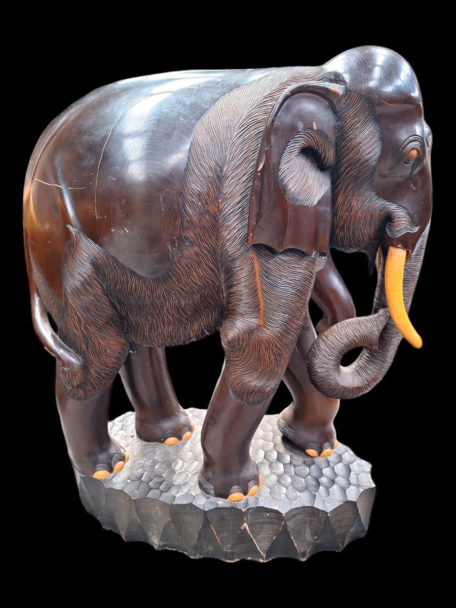 A pair of dark hardwood elephants.