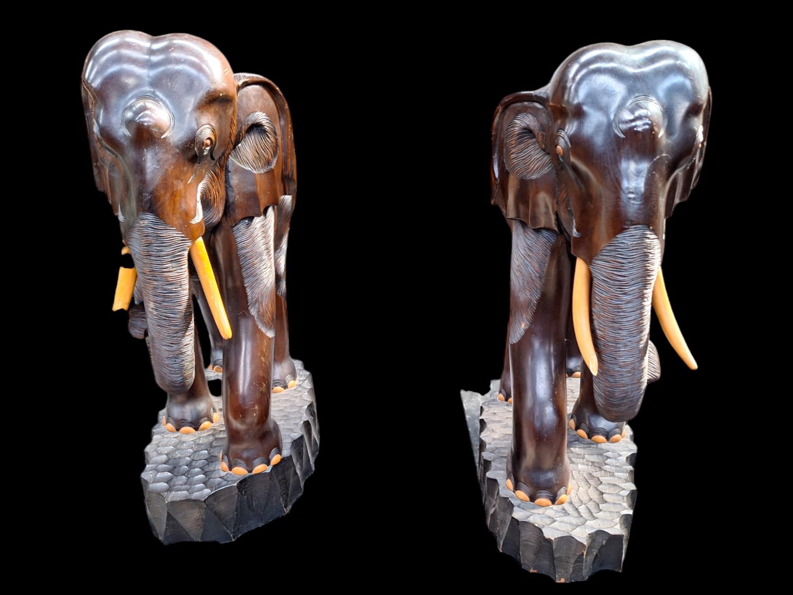 A pair of dark hardwood elephants.