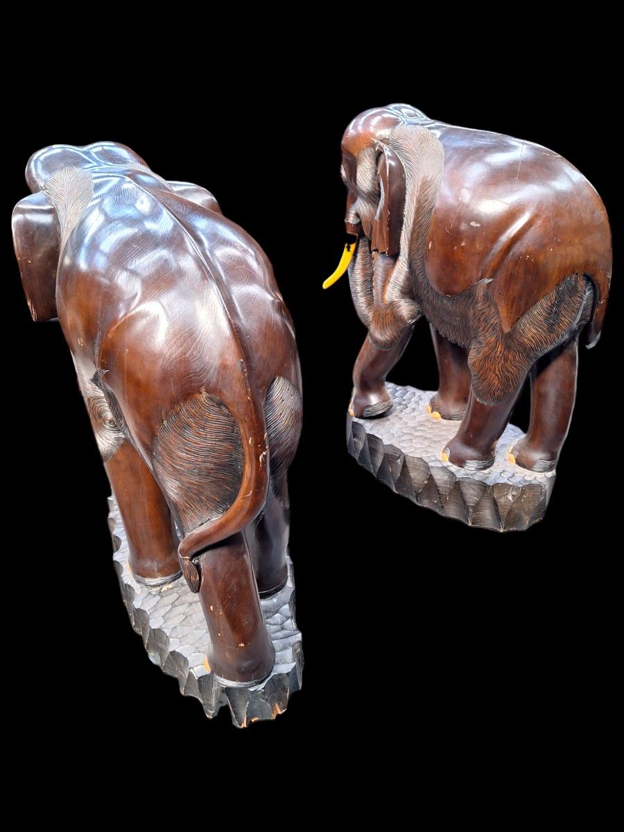 A pair of dark hardwood elephants.