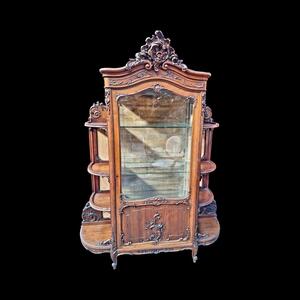 A rococo style Walnut display cabinet.