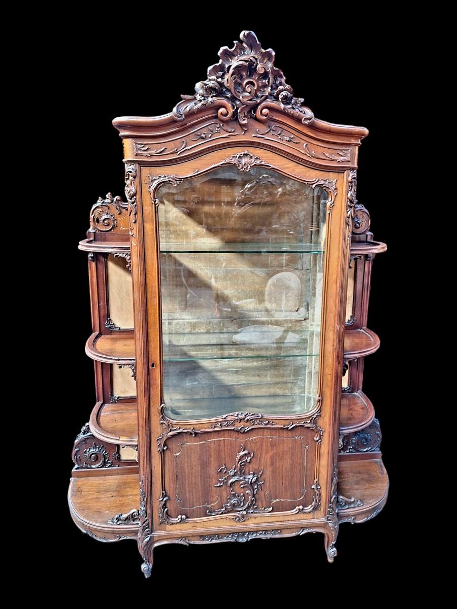 A rococo style Walnut display cabinet.