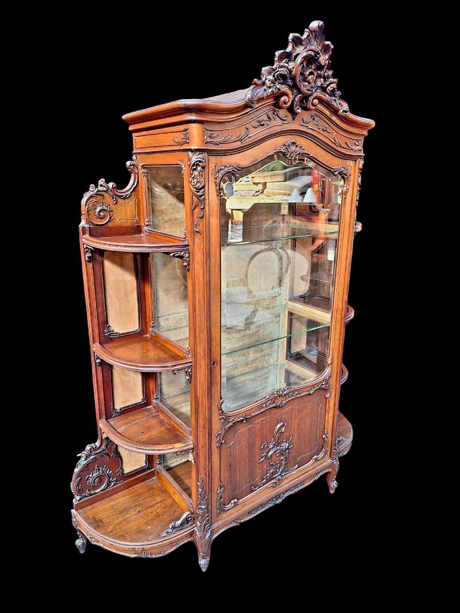 A rococo style Walnut display cabinet.