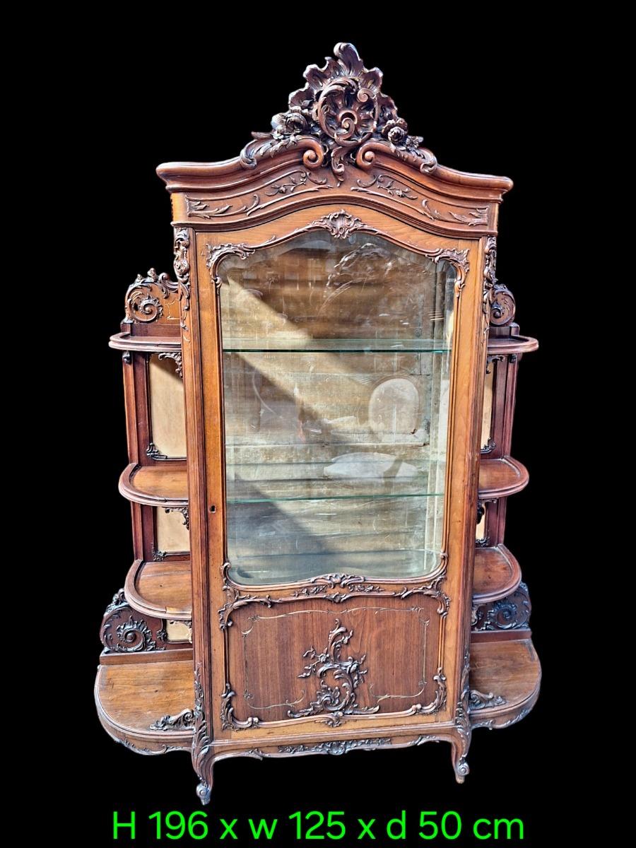 A rococo style Walnut display cabinet.