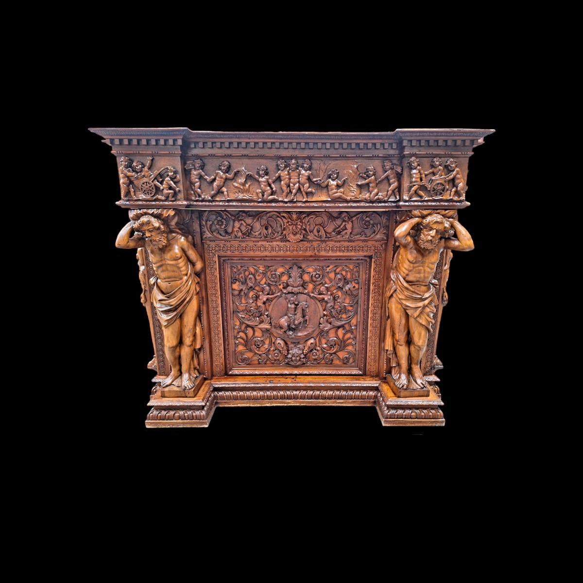 Very monumental Carved walnut firemantle in Renaissance style.