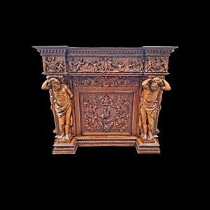 Very monumental Carved walnut firemantle in Renaissance style.