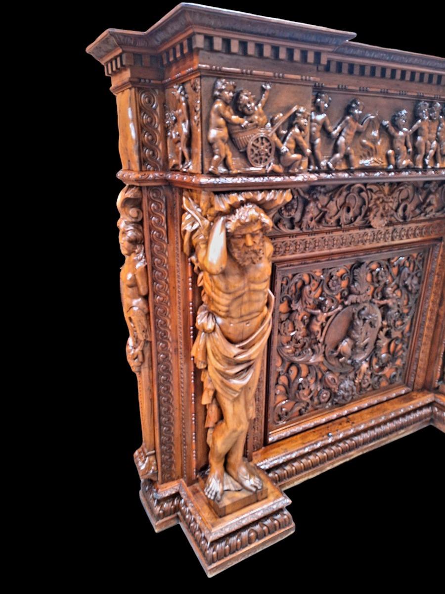 Very monumental Carved walnut firemantle in Renaissance style.