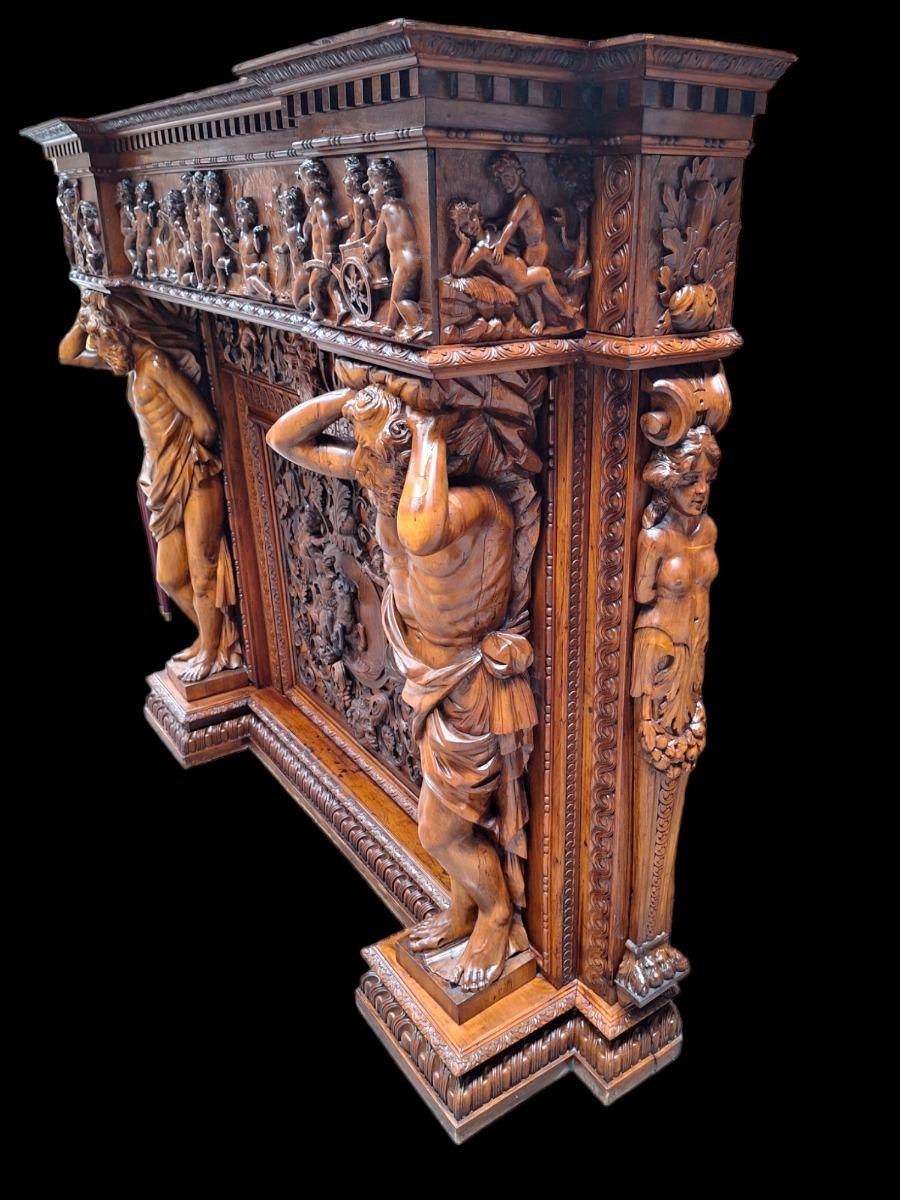 Very monumental Carved walnut firemantle in Renaissance style.