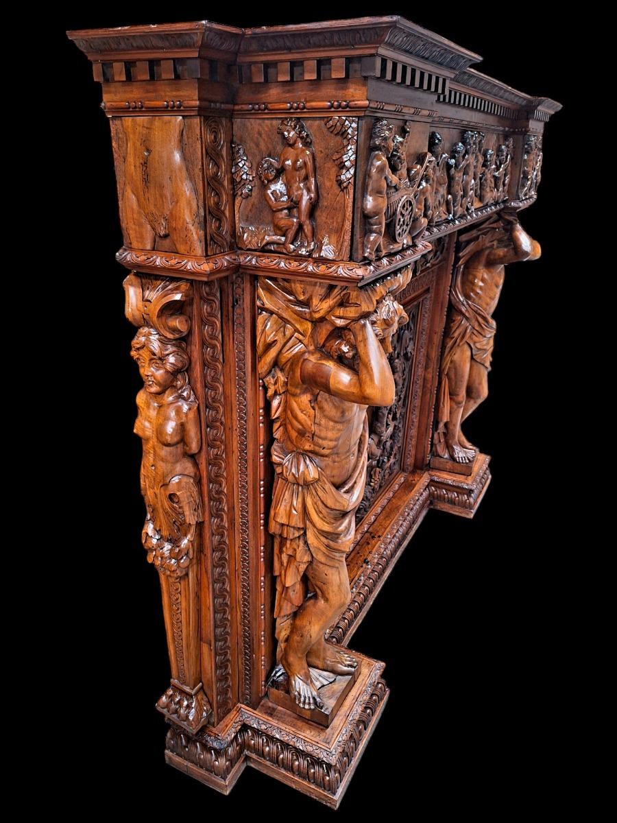 Very monumental Carved walnut firemantle in Renaissance style.