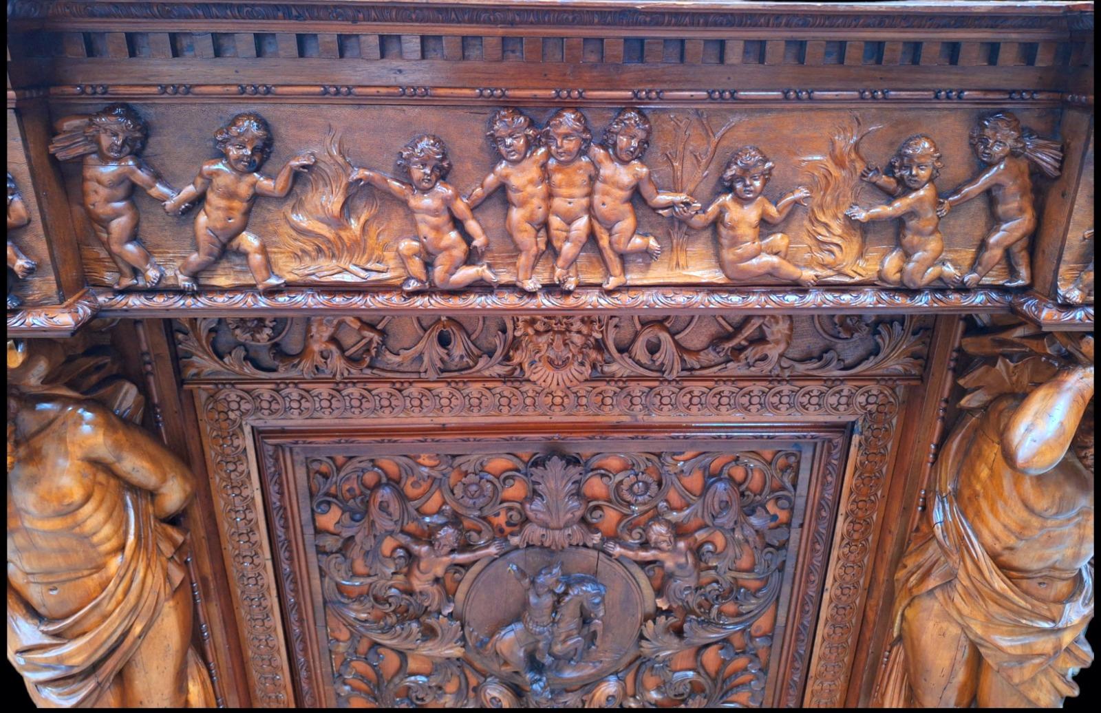 Very monumental Carved walnut firemantle in Renaissance style.