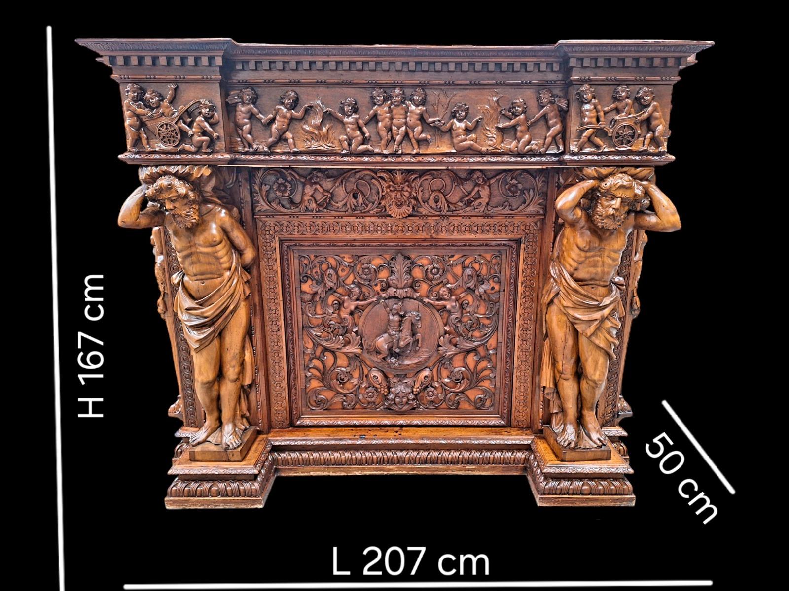 Very monumental Carved walnut firemantle in Renaissance style.