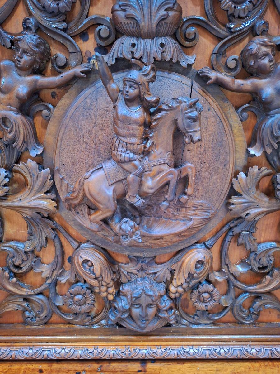 Very monumental Carved walnut firemantle in Renaissance style.