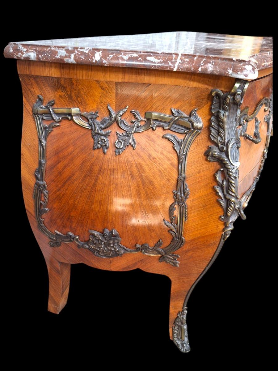 French marquetry commode with red marble top.