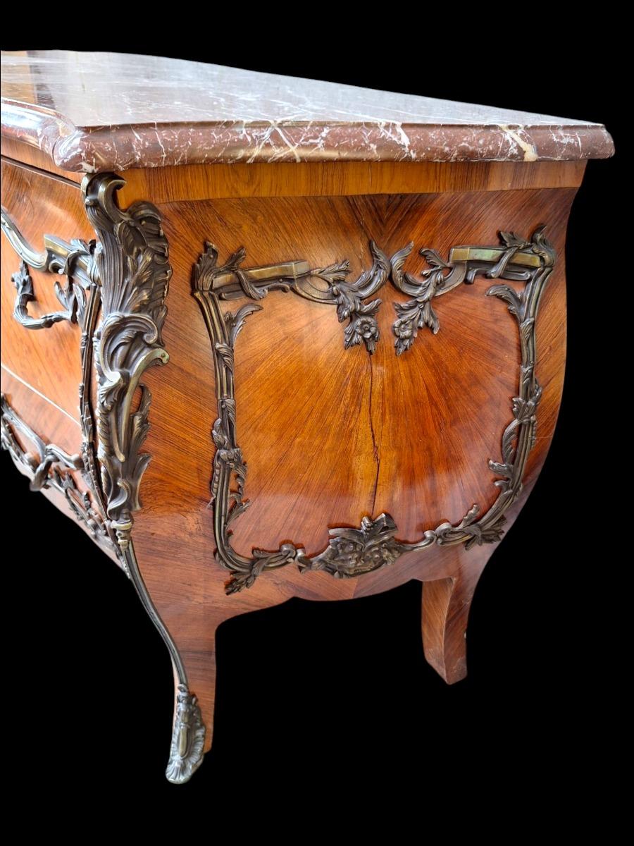 French marquetry commode with red marble top.