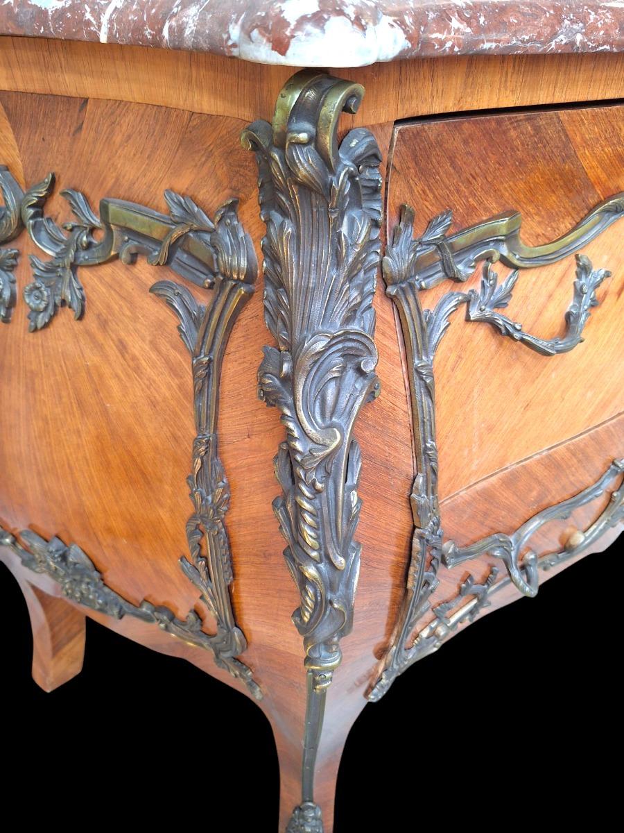 French marquetry commode with red marble top.