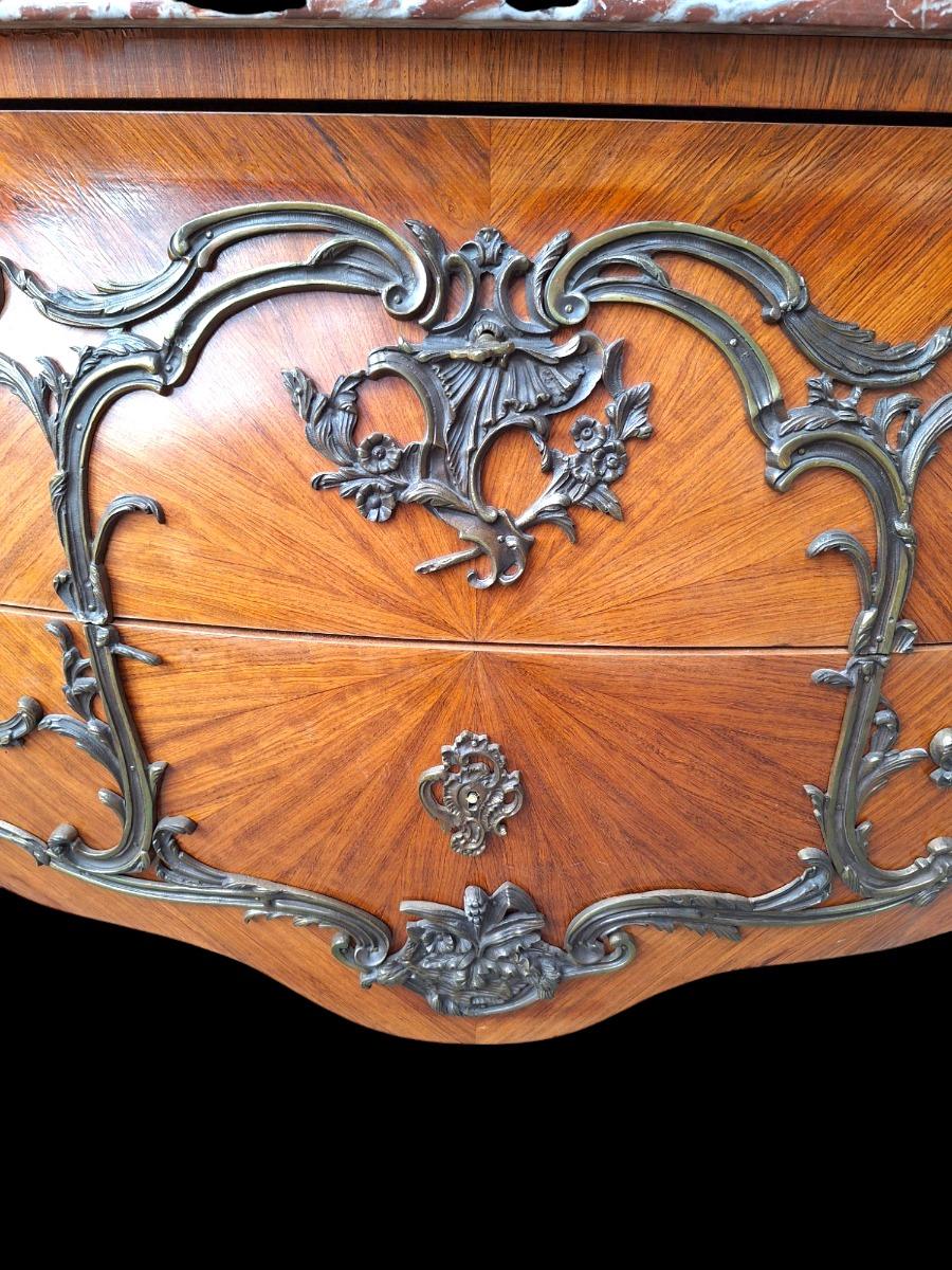 French marquetry commode with red marble top.