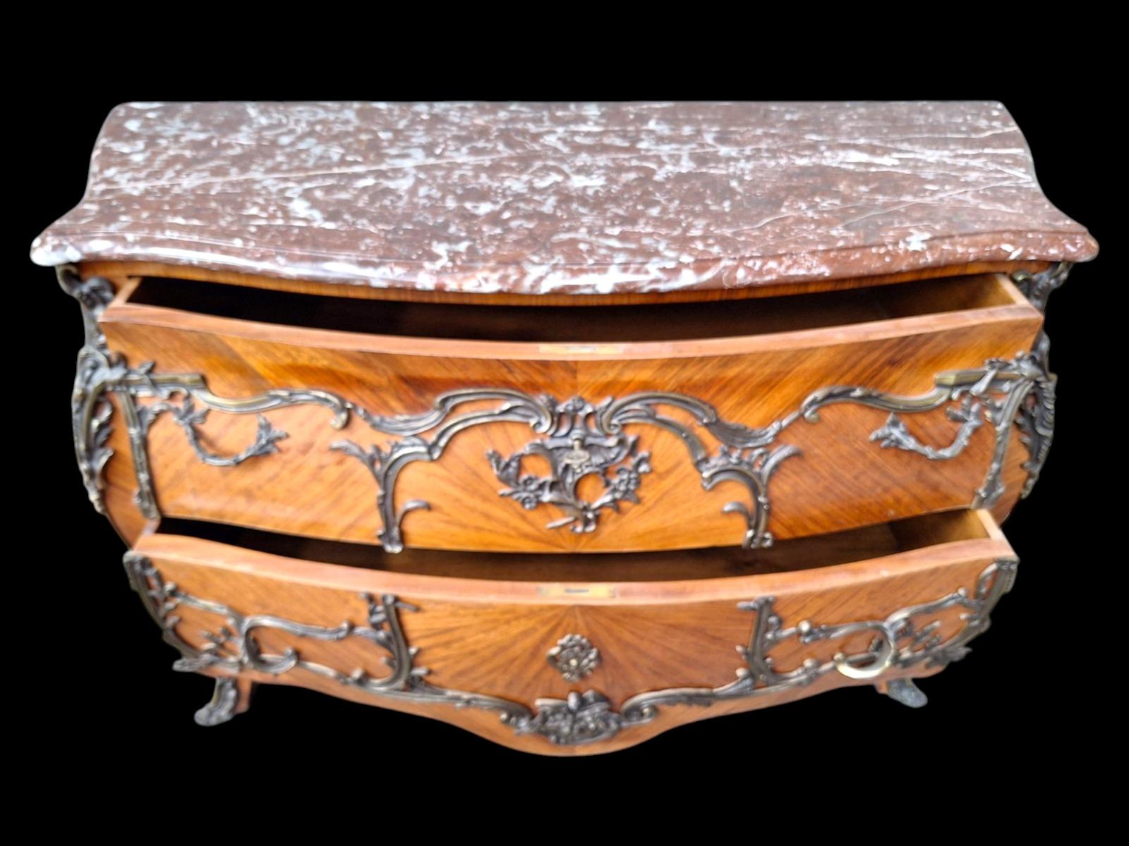 French marquetry commode with red marble top.