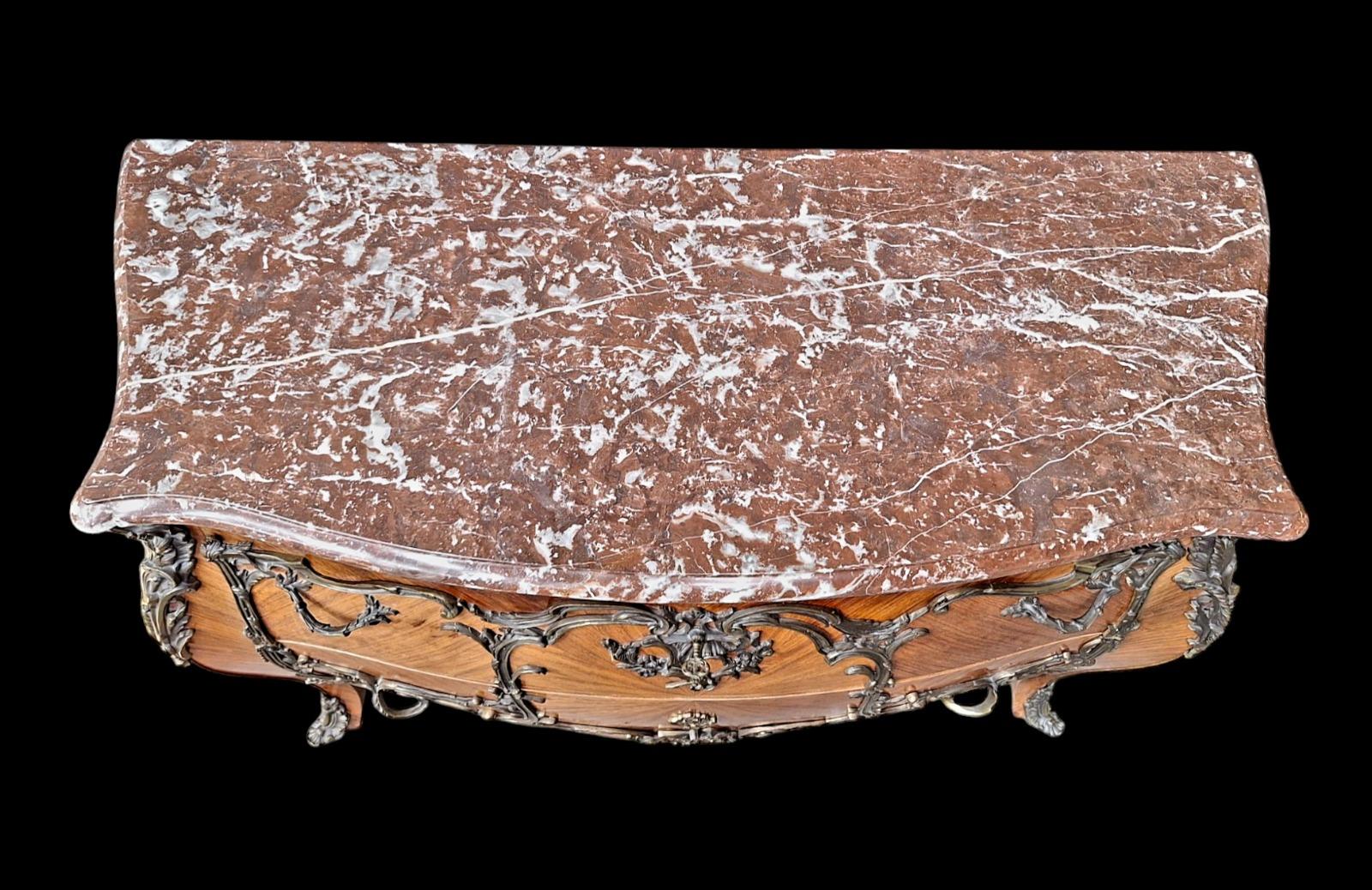 French marquetry commode with red marble top.