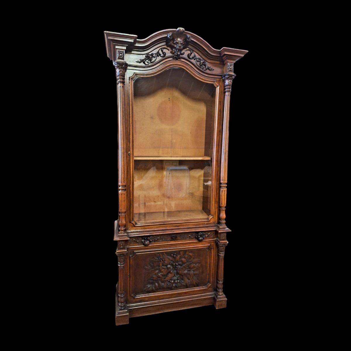 Monumental walnut display cabinet.