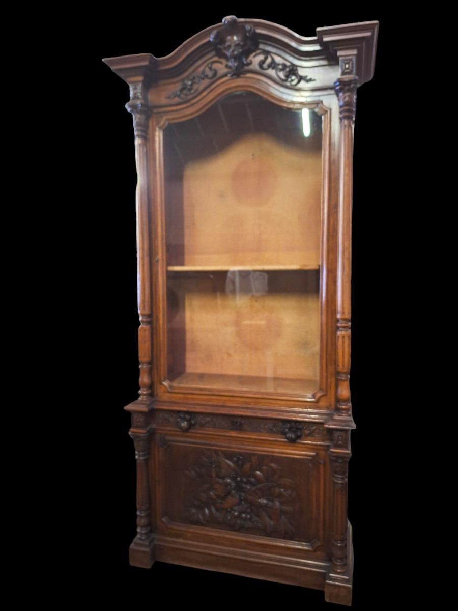 Monumental walnut display cabinet.