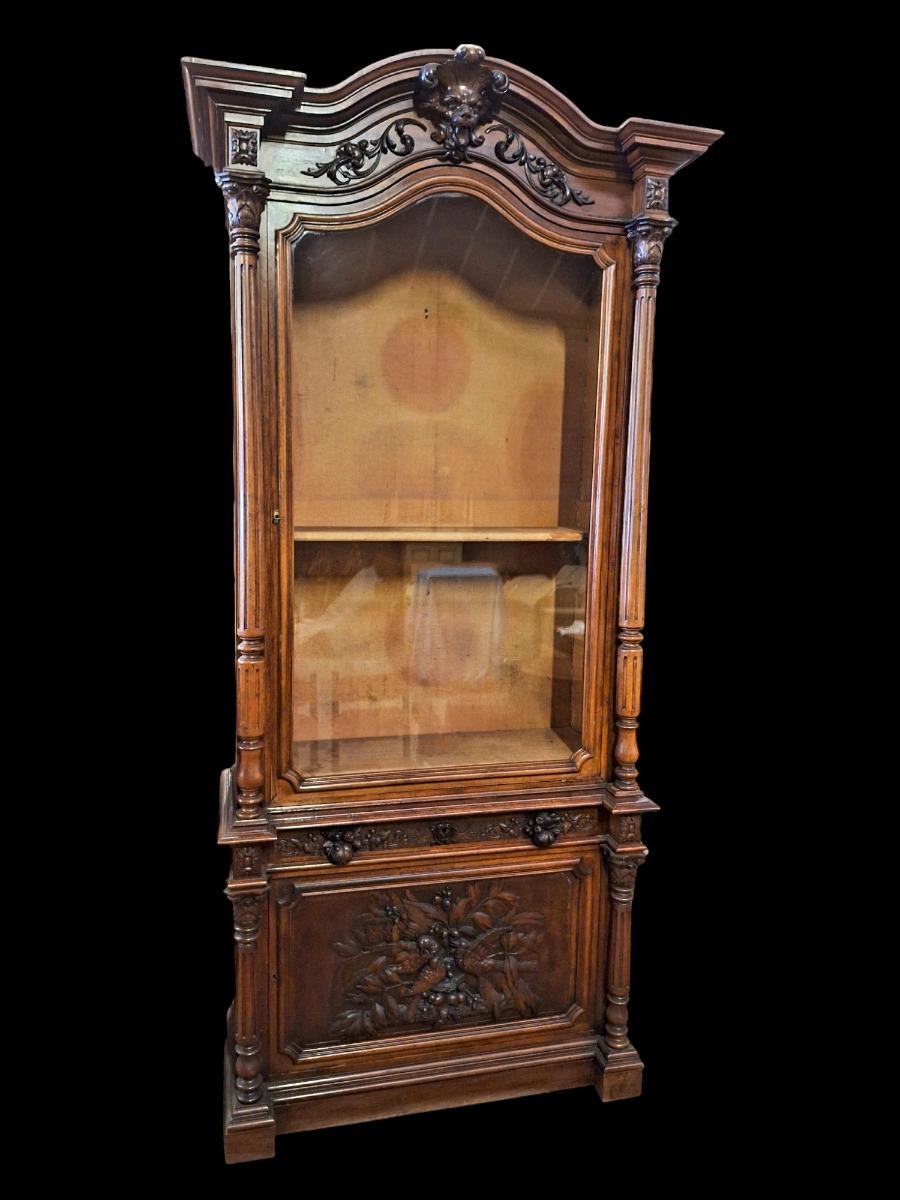 Monumental walnut display cabinet.