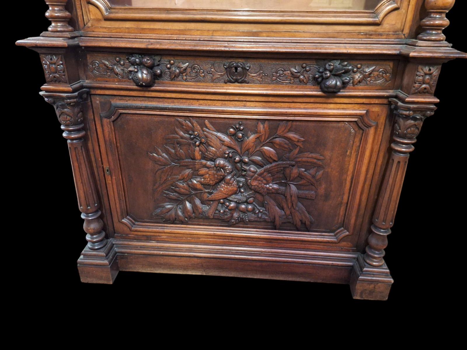 Monumental walnut display cabinet.