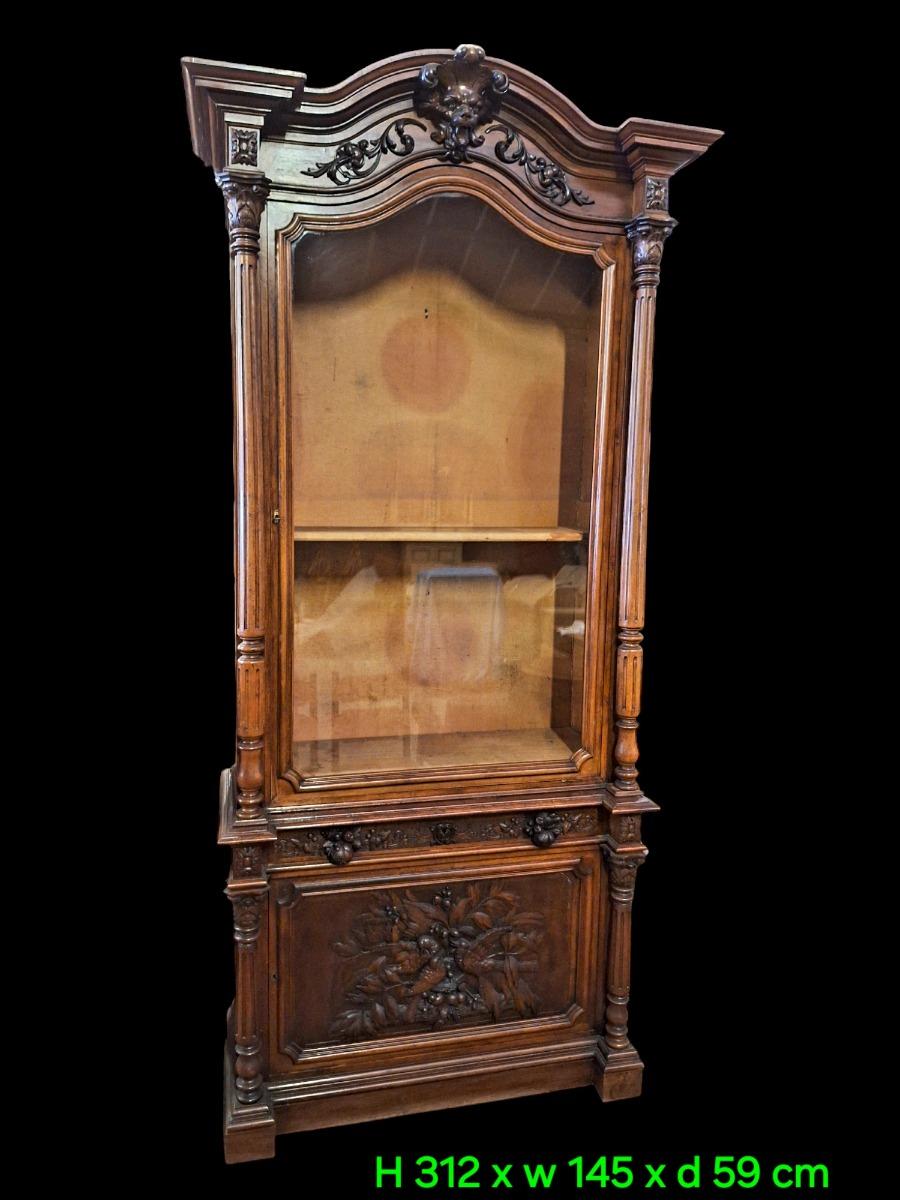 Monumental walnut display cabinet.