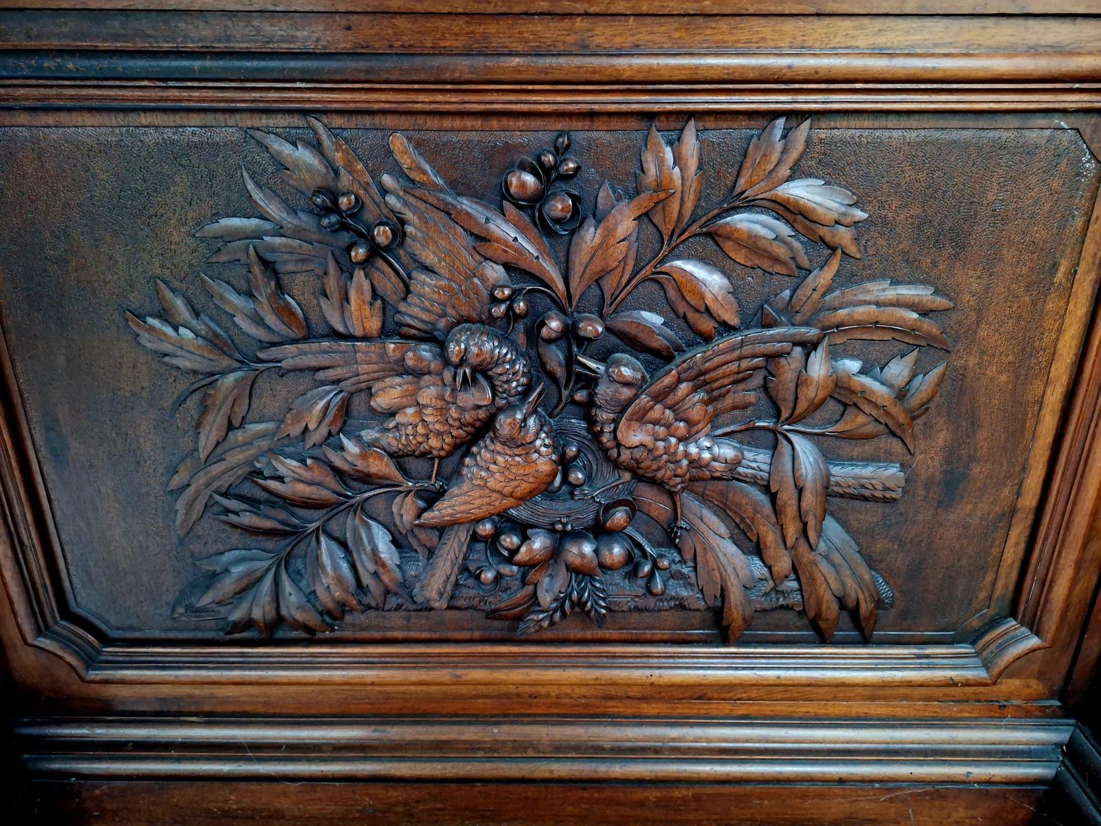 Monumental walnut display cabinet.