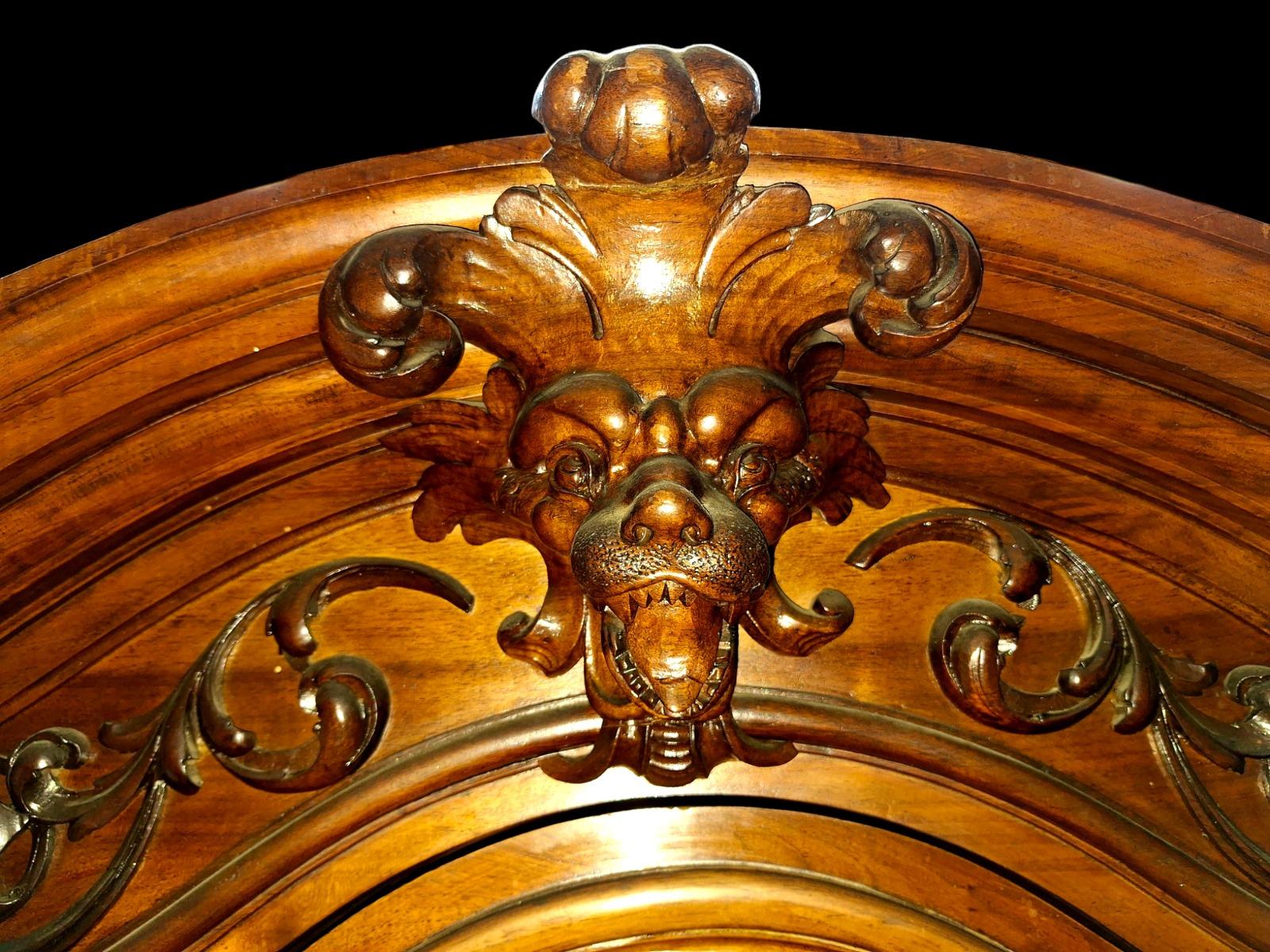 Monumental walnut display cabinet.