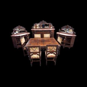 Richly carved Renaissance styled dining suite.
