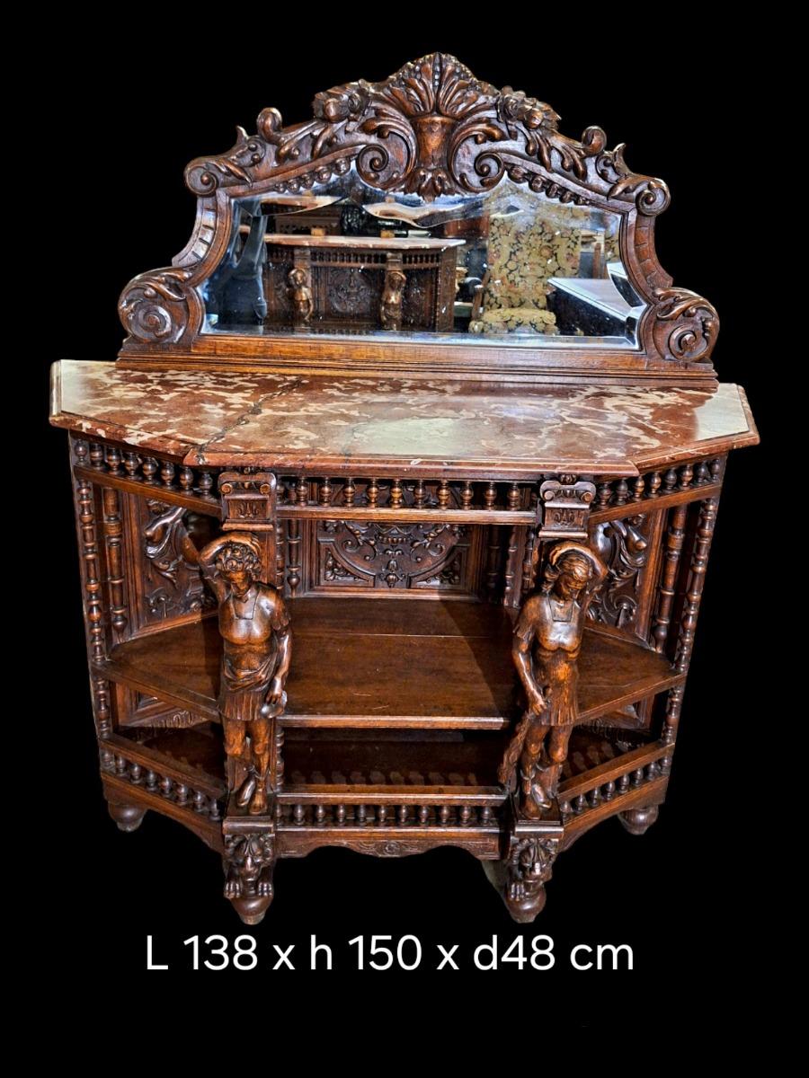 Richly carved Renaissance styled dining suite.