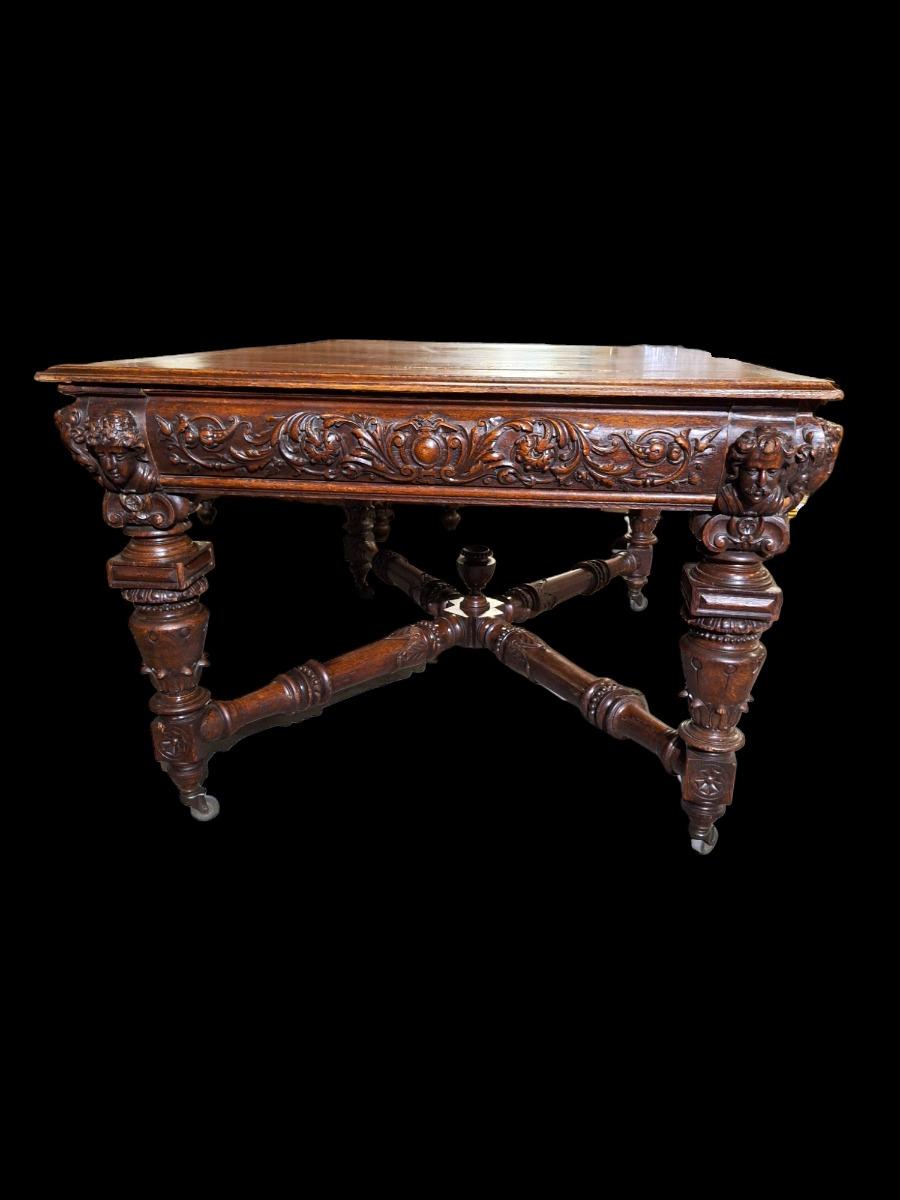 Richly carved Renaissance styled dining suite.