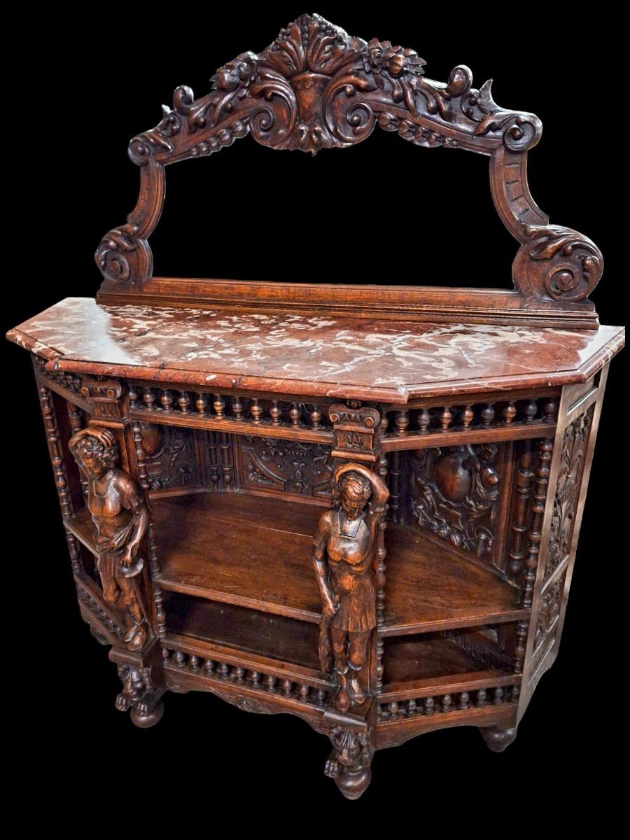 Richly carved Renaissance styled dining suite.