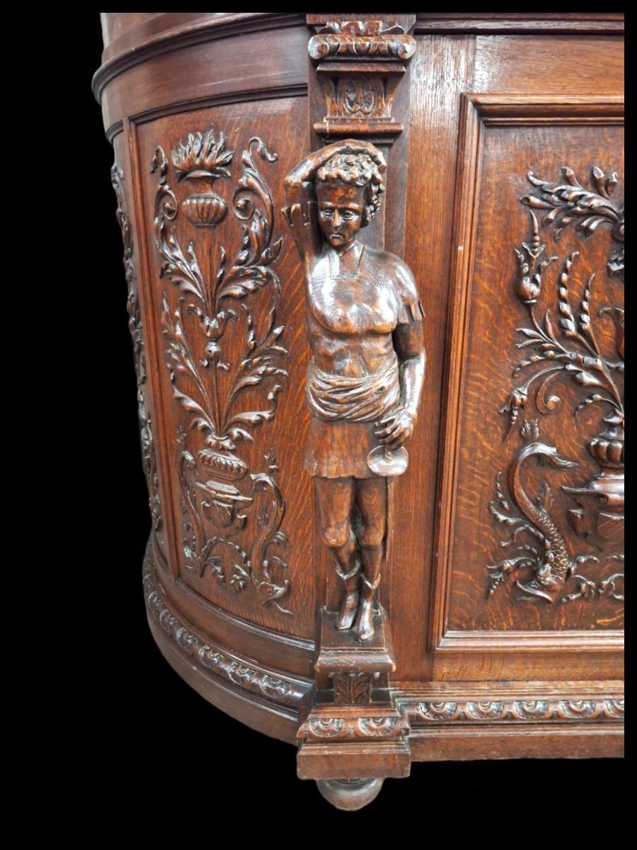 Richly carved Renaissance styled dining suite.