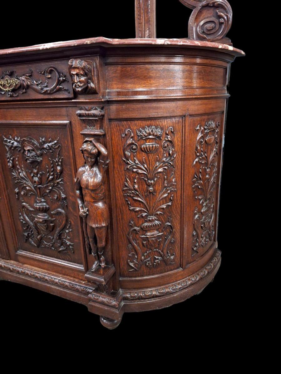 Richly carved Renaissance styled dining suite.