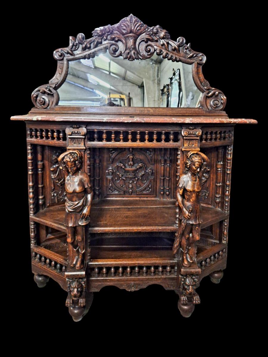 Richly carved Renaissance styled dining suite.